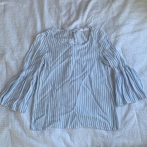 Light blue and white striped shirt. Peplum sleeves